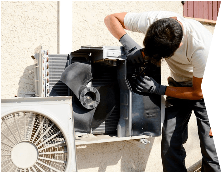 Electrician Installer Working on Outdoor Compressor Unit Air Conditioner at a Client's Home